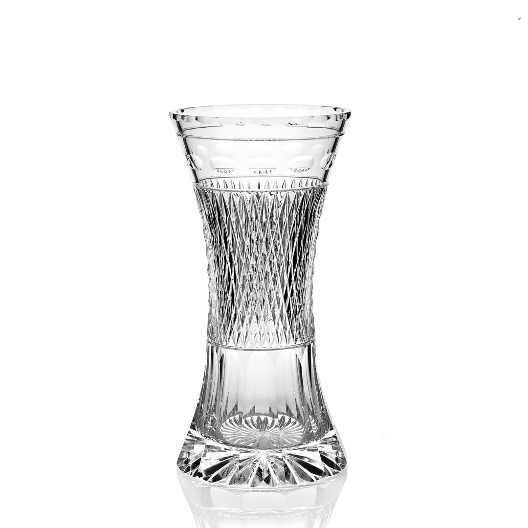 Clear crystal glass vase with diamond pattern on a white background