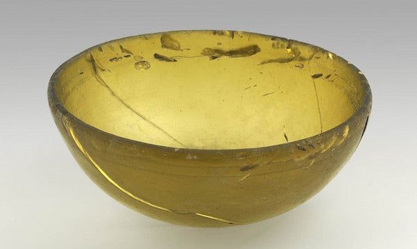 Figure 3. Levantine, Amber glass wine cup, moulded glass, Levant (modern day Syria) (ca. 100 BC-AD 100). Image courtesy of the Allard Pierson Museum, Amsterdam.